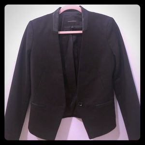 Black collarless blazer